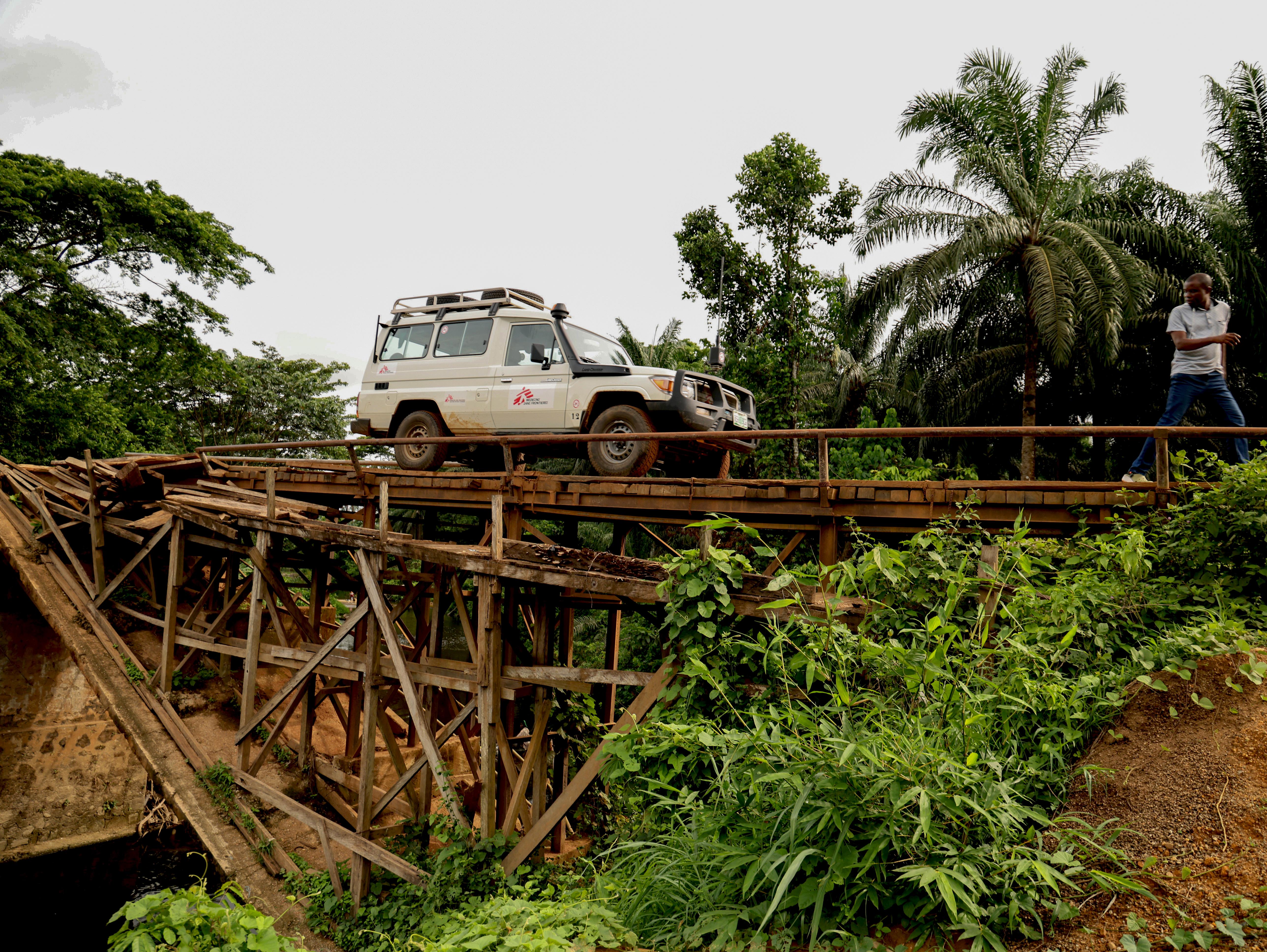 An MSF truck crosses a wooden bridge, a short distance away from a primary healthcare facility in Cross River state. 