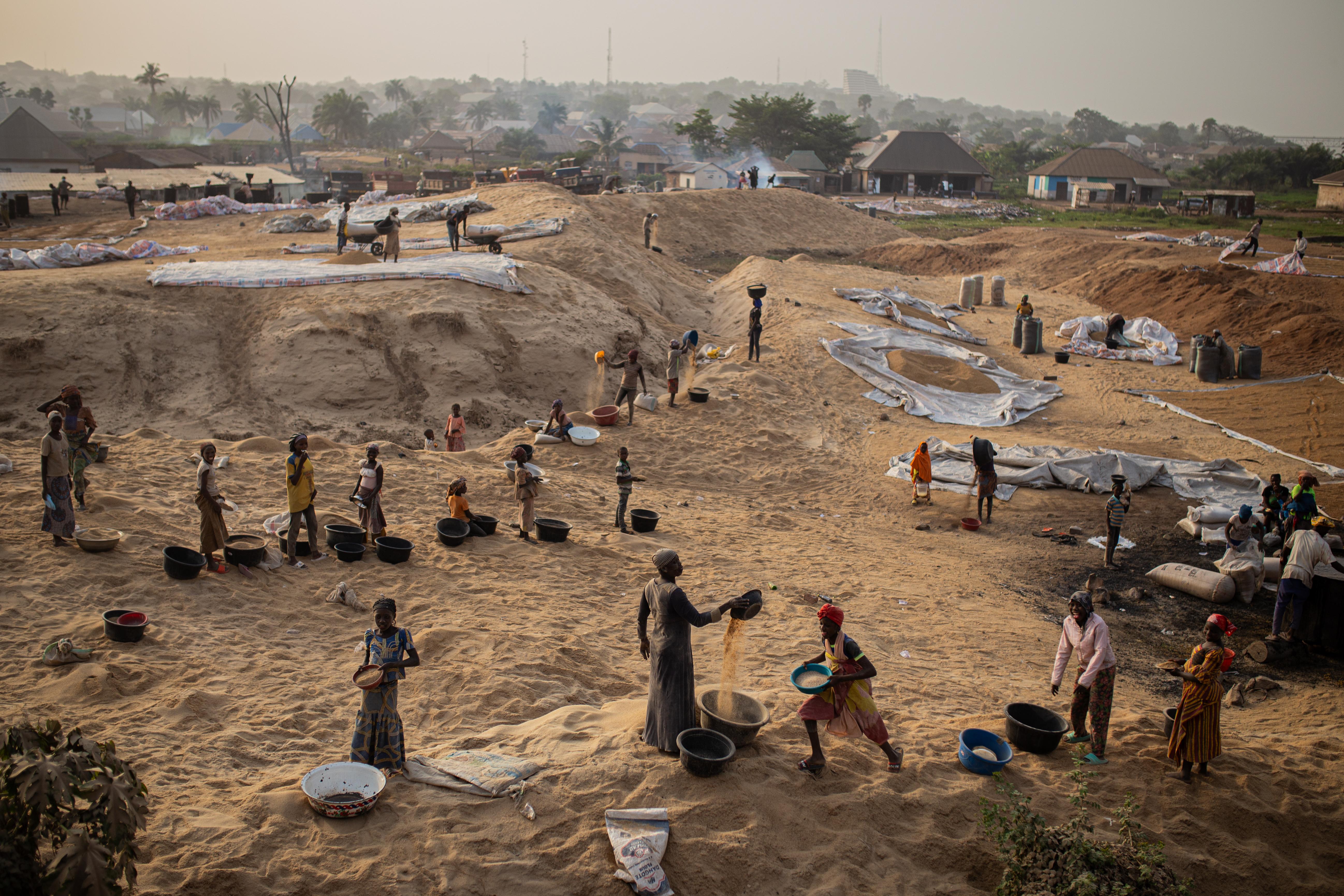 People working at a mill in Makurdi town, capital of Benue state