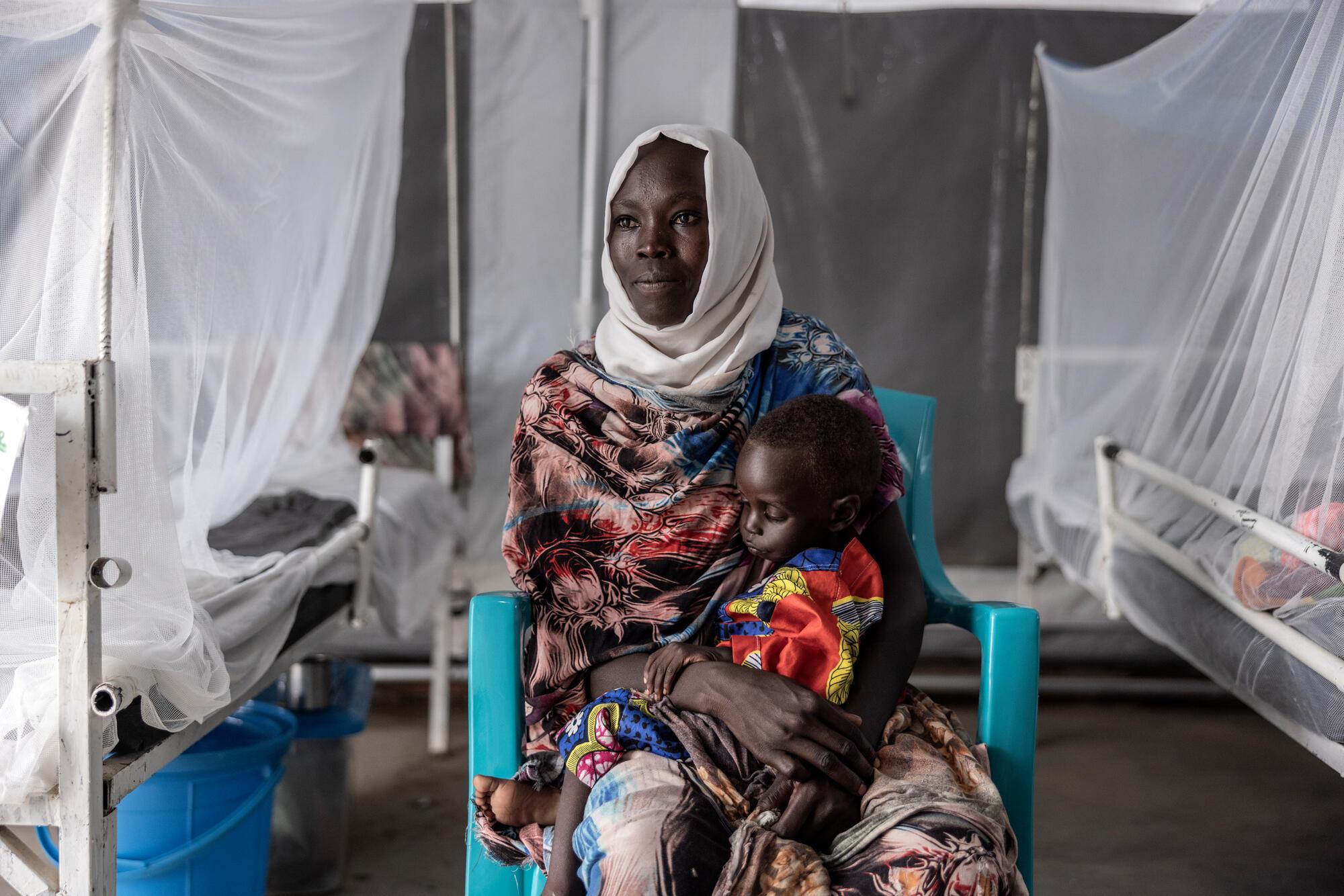 A mother and child inside the therapeutic feeding center for malnourished children at the MSF hospital in Metche, eastern Chad