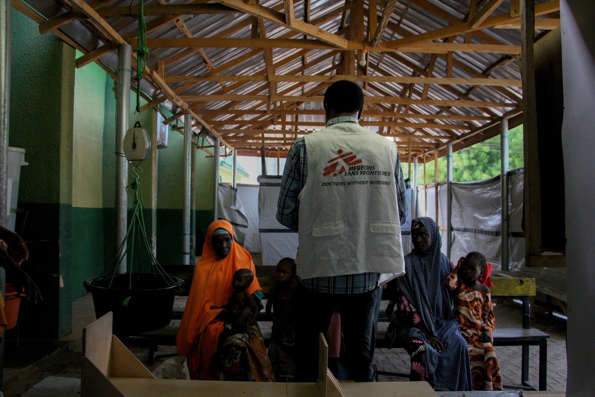 MSF nurse Isa Dauda speaks to the caregivers at the triage of the inpatient therapeutic feeding centre in Zurmi general hospital, Zamfara state.