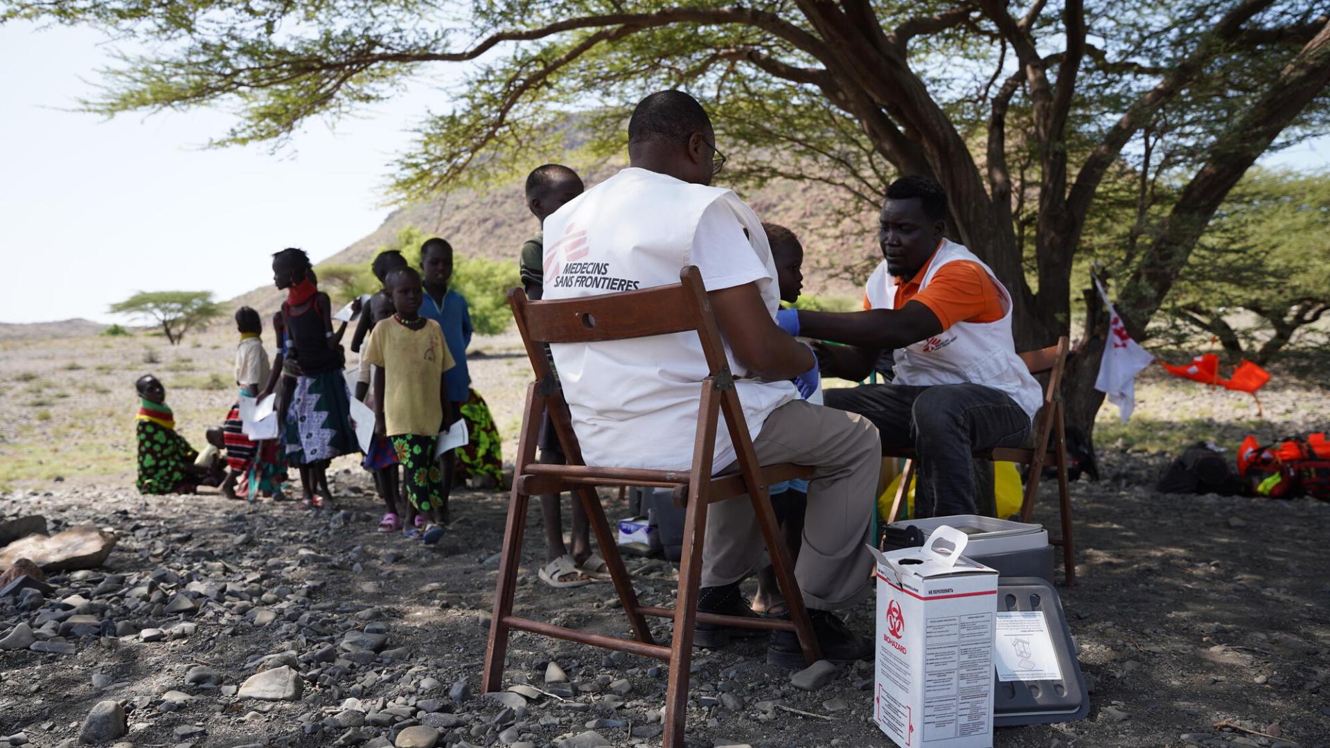 MSF team members vaccinating a child against measles at Napek village in Moite, Marsabit County.