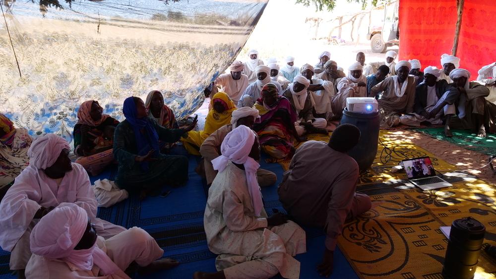 Screening of the 20-minute participatory video to members of the community in Goz kibine in Dogdore North.