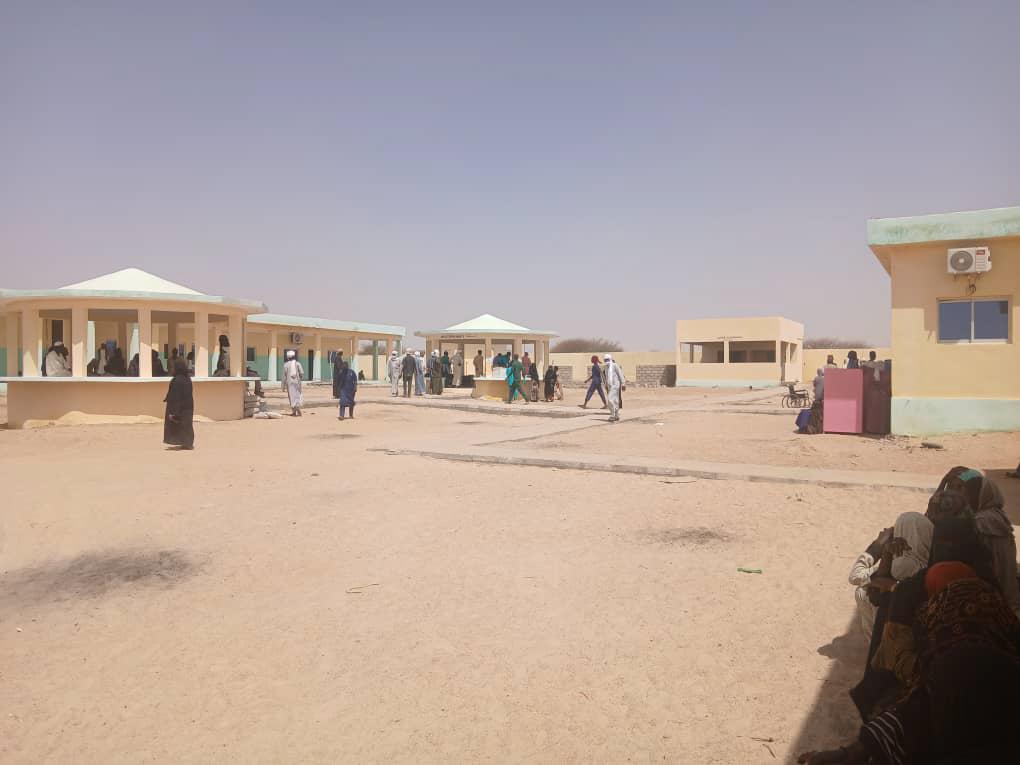 People walk around the compound of a hospital in Tiné. Chad, March 2026.