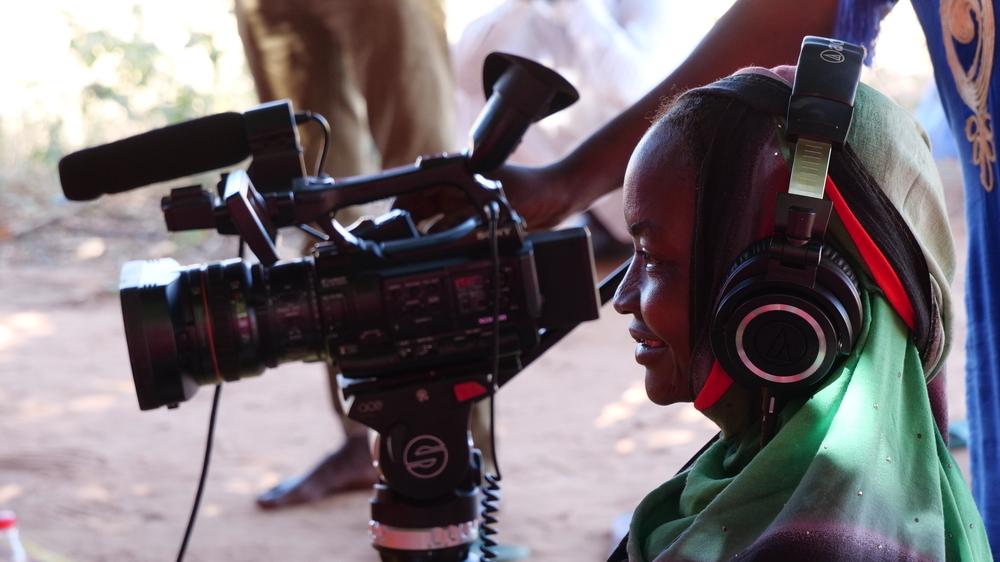 A lady takes a video in the Media fellowship 2025