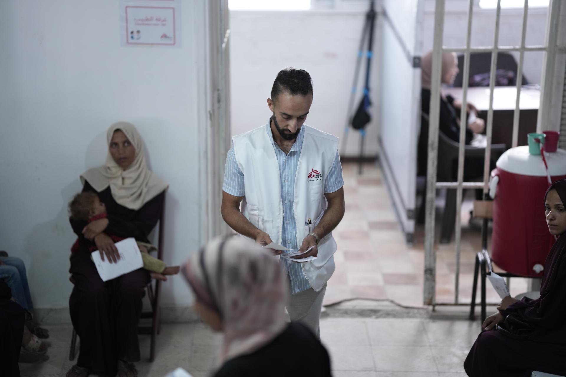 MSF staff arranging the entry of patients to the medical staff in Gaza clinic in Gaza city. 