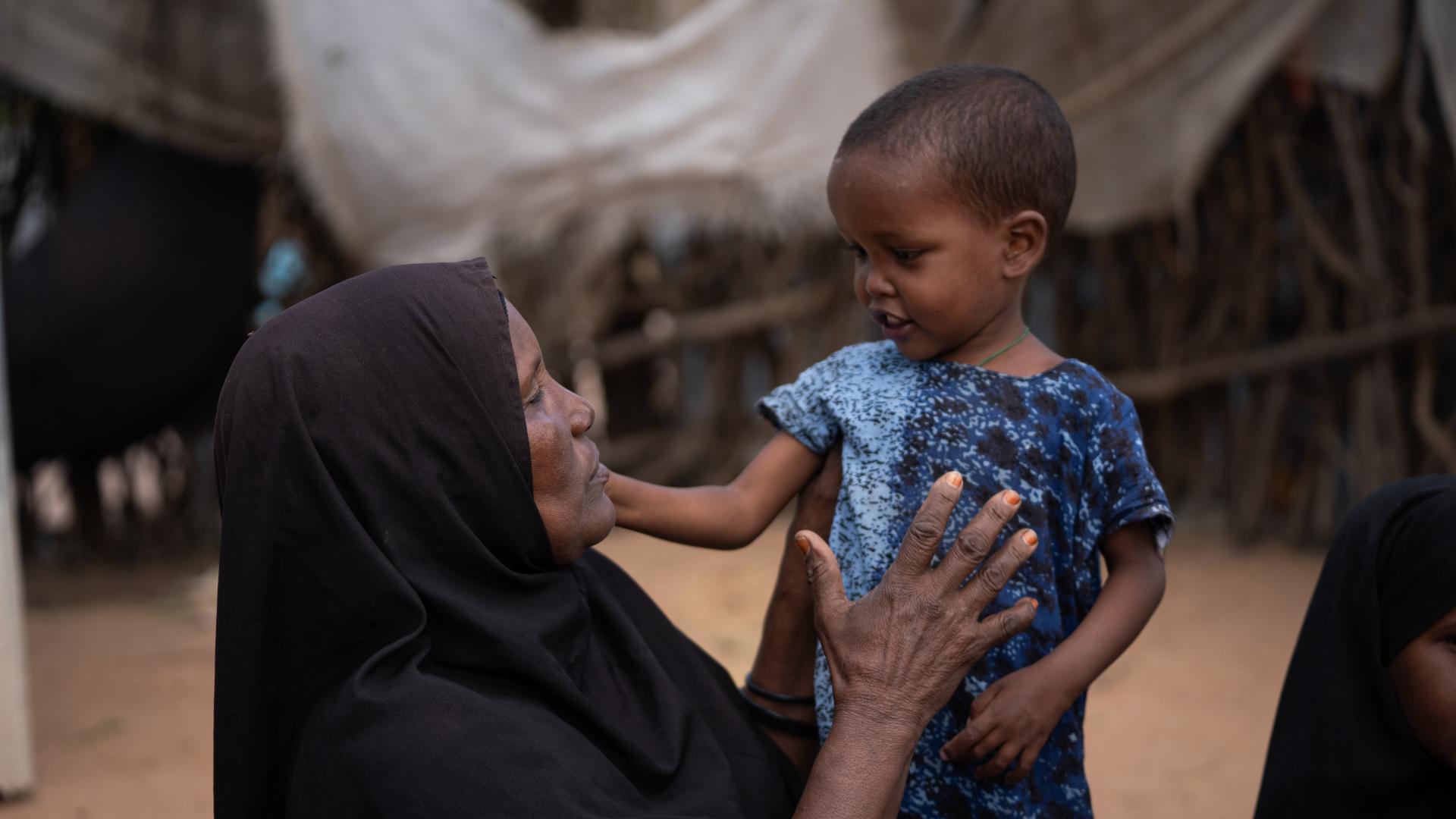 Abdiya Hussein Biri, a newly arrived, unregistered and unprofiled refugee with her child.