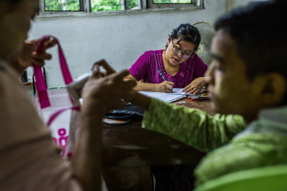 YANGON, MYANMAR – Patients receive medicine after a counselling session at MSF's Insein clinic. Some of these patients are on their last visit to this clinic as they will soon be transferred to Myanmar’s National AIDS Programme for continued treatment. [