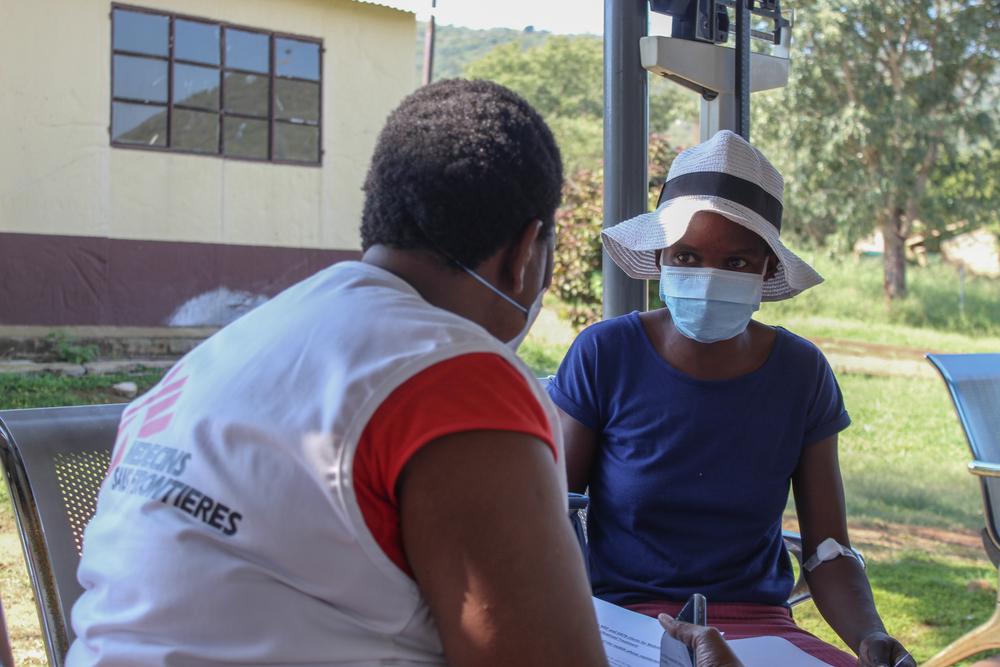 MSF nurse giving a training to a female MDR-TB patient in Matsanjeni health centre how to use Video 