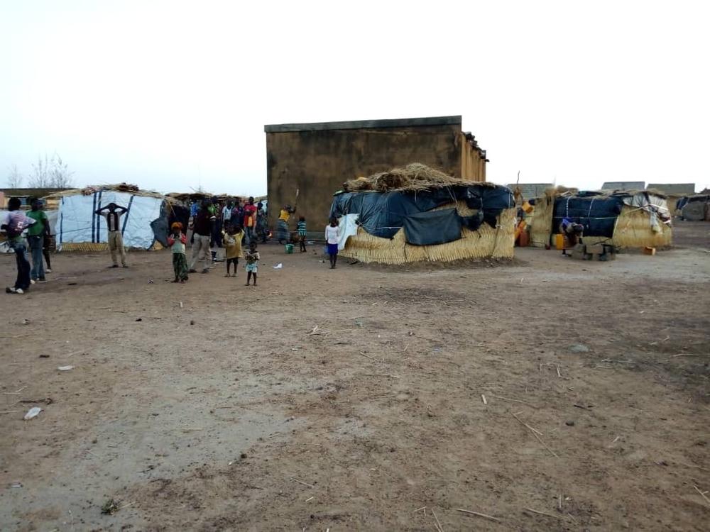 Displaced families live in makeshift shelters in Fada, 