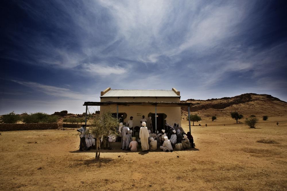 An MSF team talks to a group of men in Dar Zaghawa, in North Darfur state