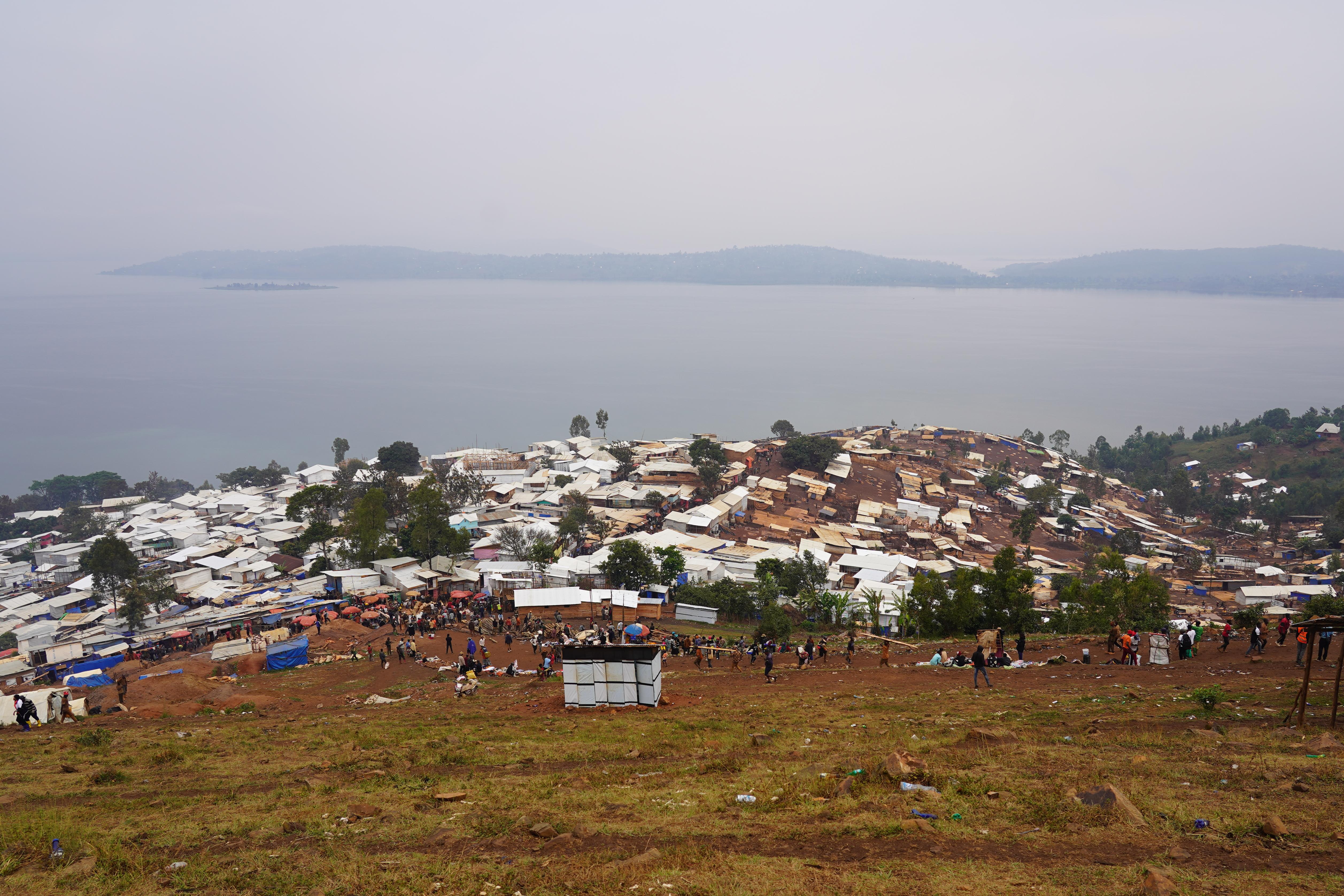 A sprawling settlement of makeshift shelters in Lomera, South Kivu, where rapid population growth and poor sanitation heighten cholera outbreak risks.