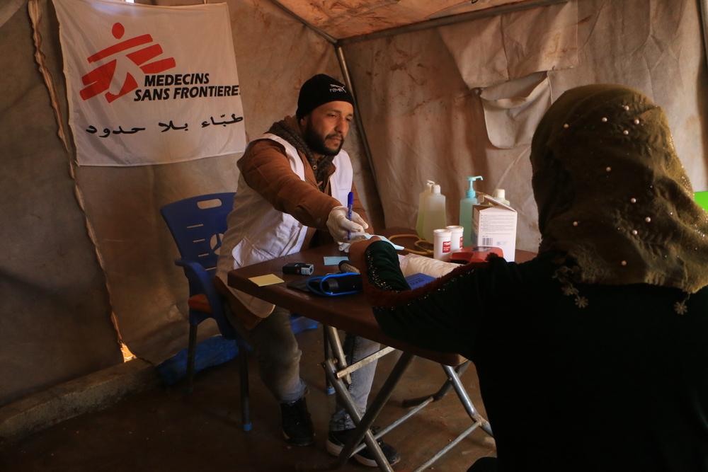 Syria; A MSF nurse registers a patient at the mobile clinic set up in Al-Fuqara camp, Al-Dana area
