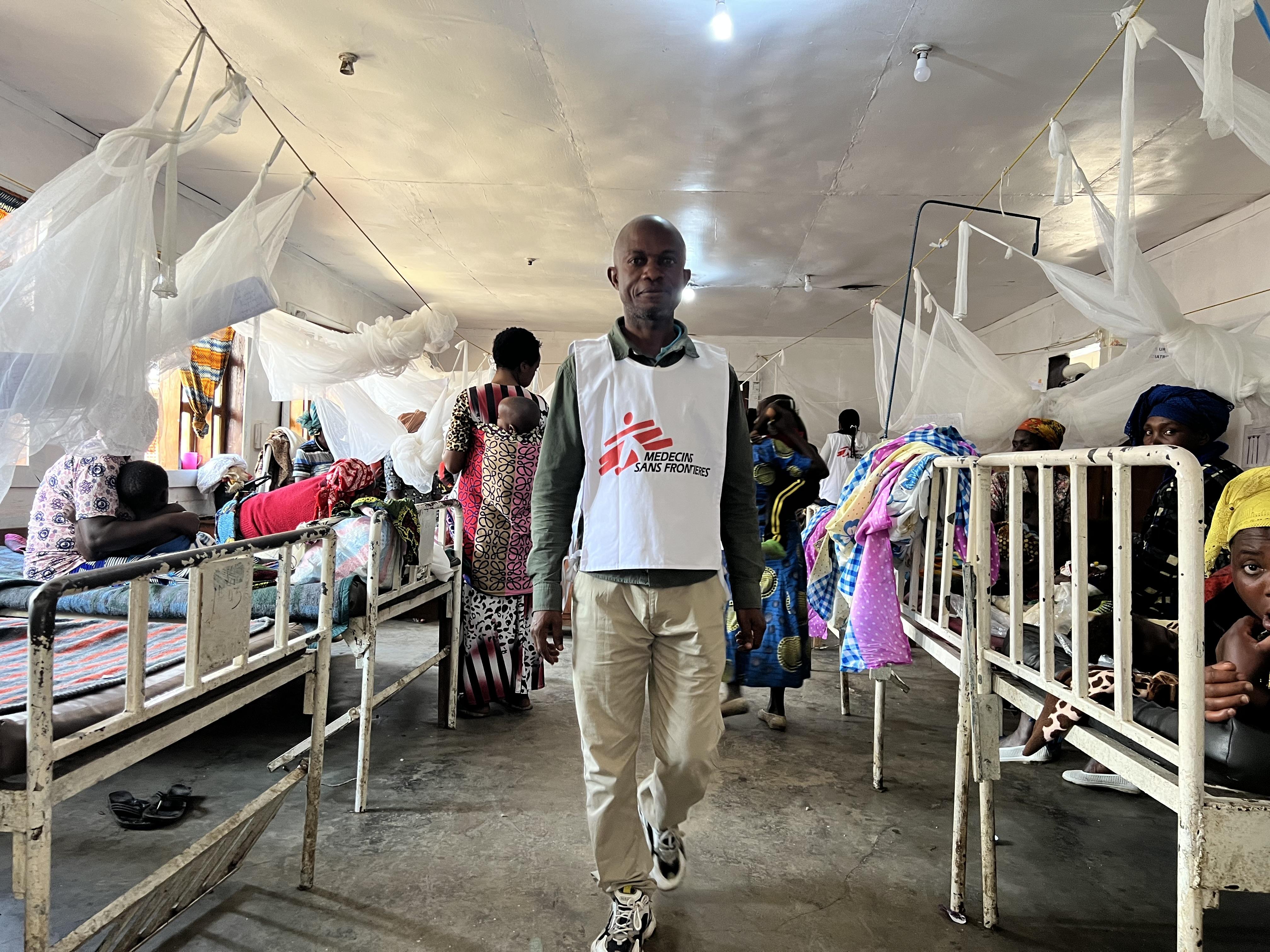 An MSF staff member walks through a ward full of patients at the Minova General Referral Hospital, in South Kivu province of eastern DRC.