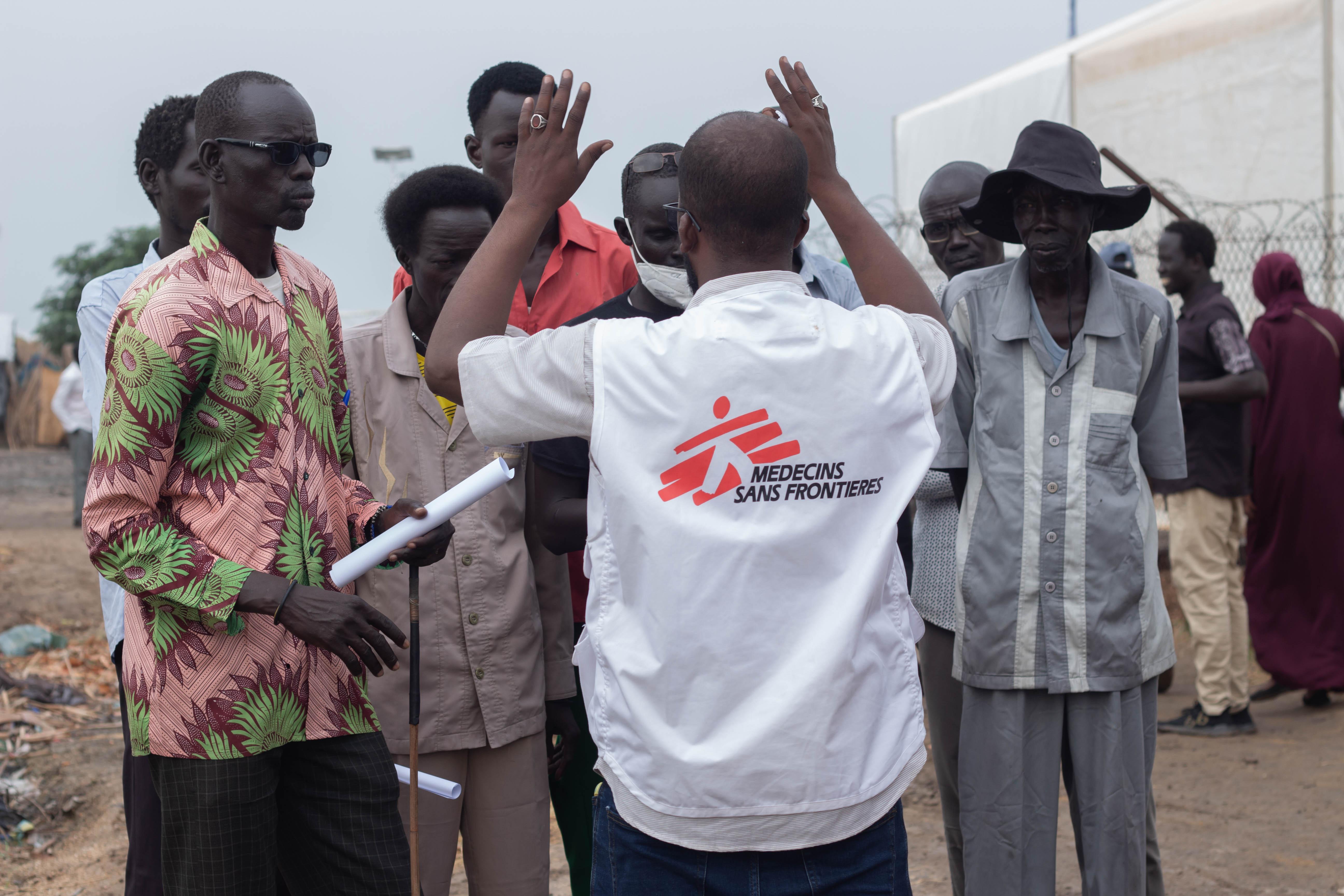 MSF staff organizing a measles vaccination campaign with community leaders of the Um Sangour camp, White Nile state, Sudan