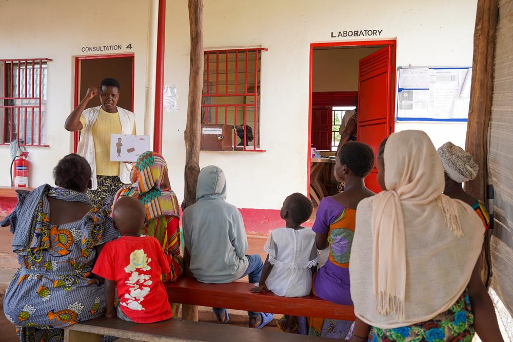 Sarah Aquila, Community Health Educator, conducts an awareness session on health promotion with patients waiting for their medical consultation in Jansuk Clinic,