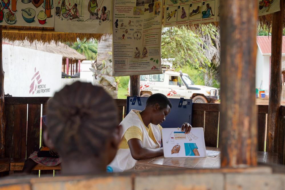Sarah Aquila, Community Health Educator, sits with mothers before their antenatal care consultations in Jansuk Clinic, Yei County, Central Equatoria.