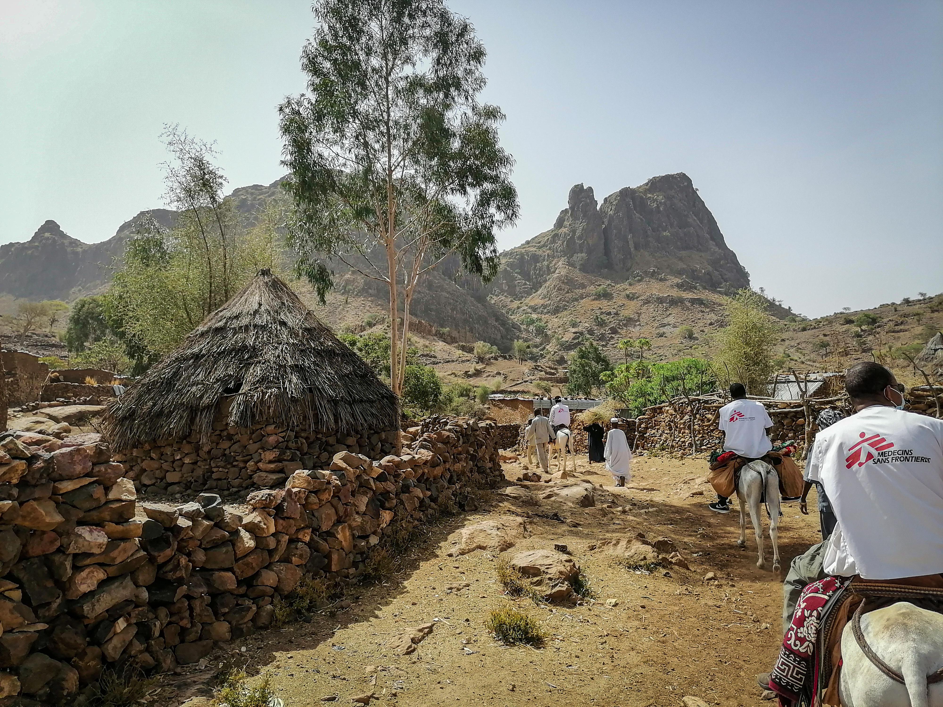 MSF team on outreach in remote rocky Jebel Marra on donkeys