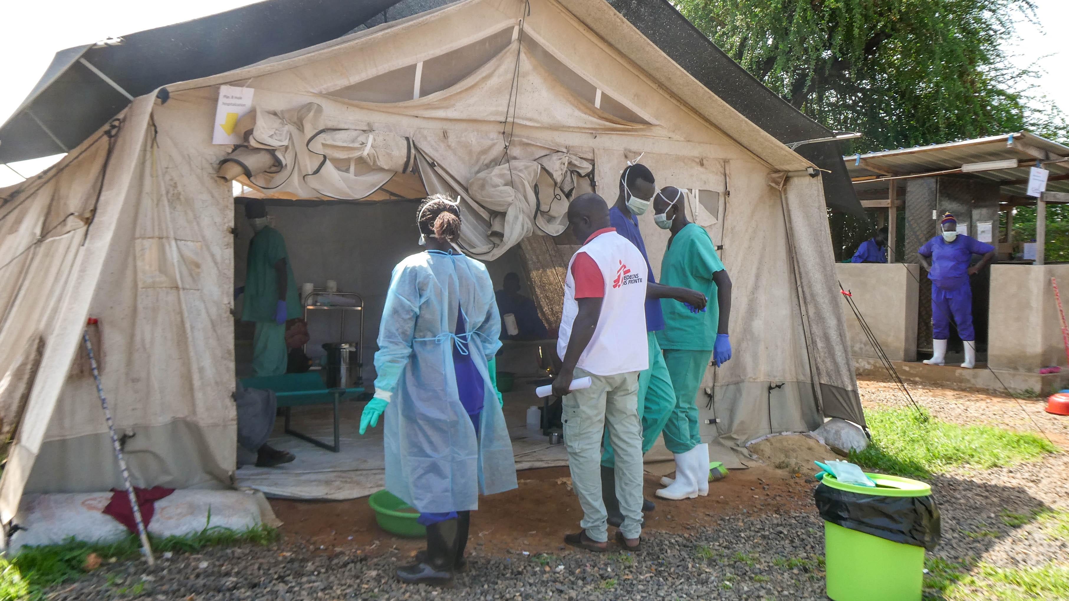 MSF medical staff stand outside a tent at the cholera treatment unit in Abyei during the outbreak response.