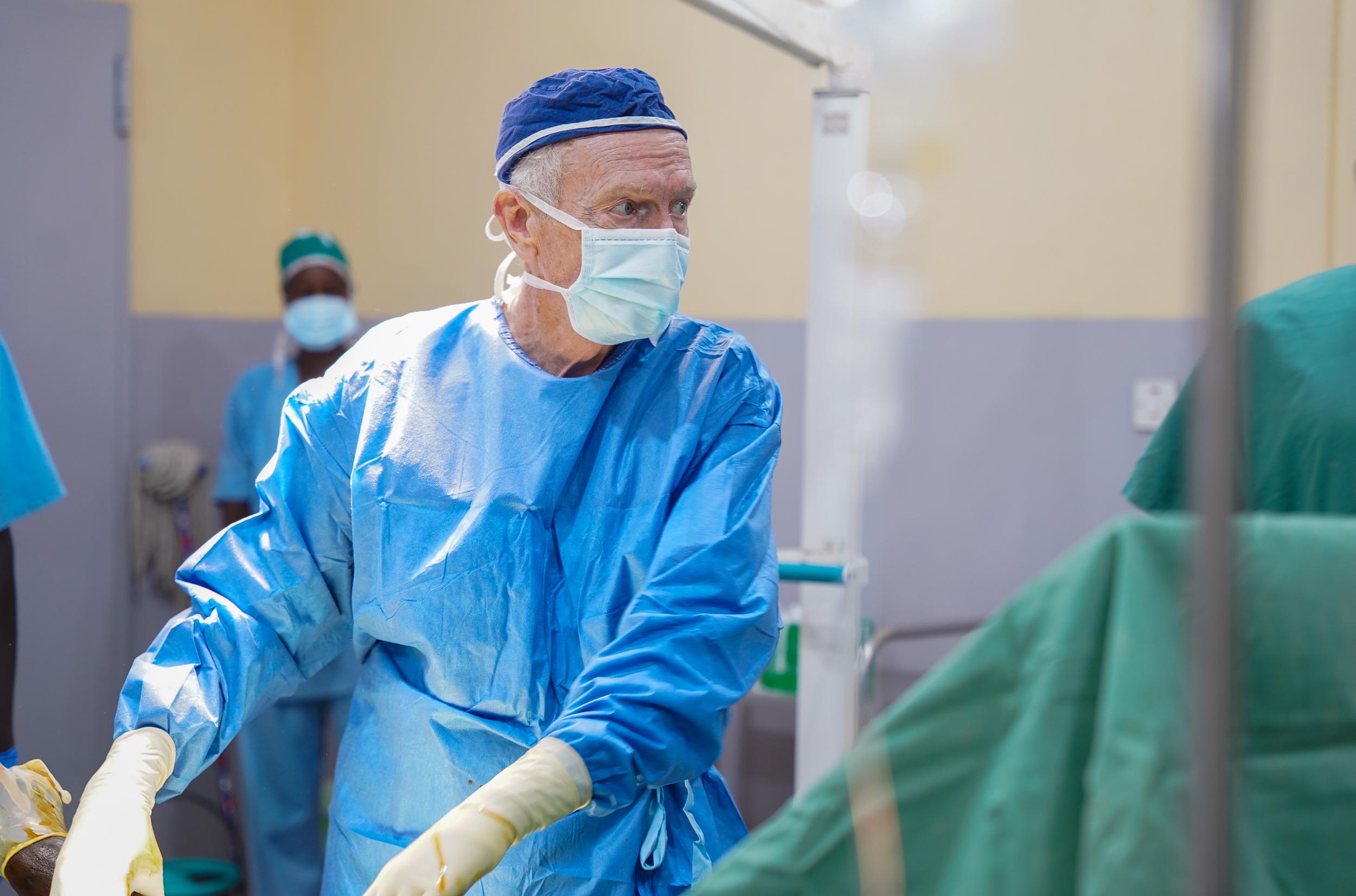 An MSF surgeon, Dr. David Elliot performs an operation on a wounded patient in the operating room of the Bentiu State Hospital