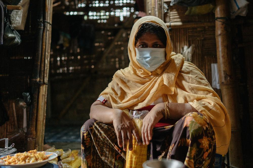 Rayhana, a Rohingya food stall owner, in her shelter. Bangladesh, June 2025.