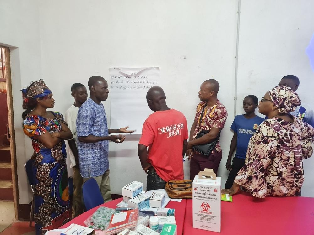 Dr Amangara Damon Togo, diabetes consultant and trainer, conducting a session on diabetes care and patient self-management for health staff and diabetic patients in Carnot.