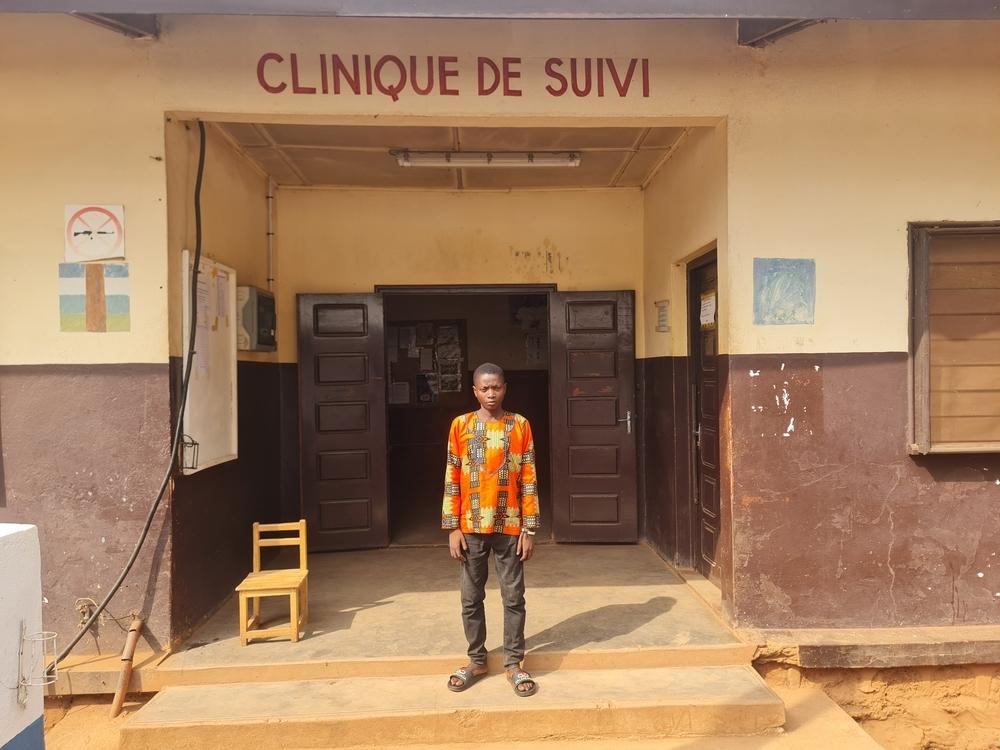 Adolphe Andao, 22, a type 1 diabetes patient, in front of the chronic disease follow-up clinic run by MSF at Carnot Hospital.
