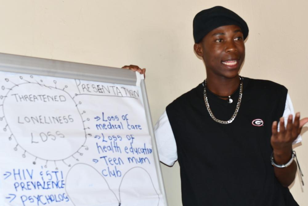 Thormilson Thompson shares feedback to MSF staff members during a review and planning meeting for the adolescents advisory committee.