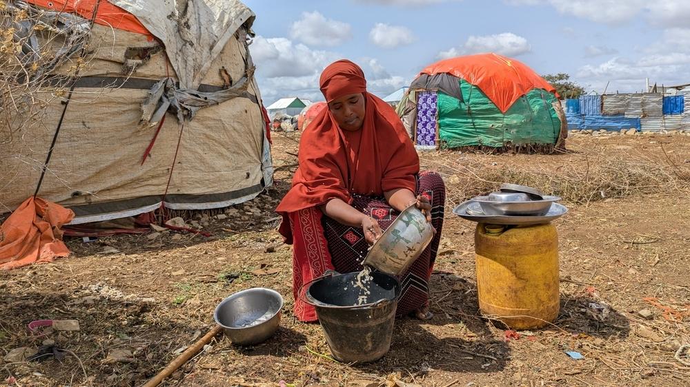 Muna Ibrahim, 39, a mother of five, washes dishes at her compound in Nimole IDP camp, Baidoa, Somalia. Nimole is one of the camps where MSF provides water and sanitation support as part of its drought response.
