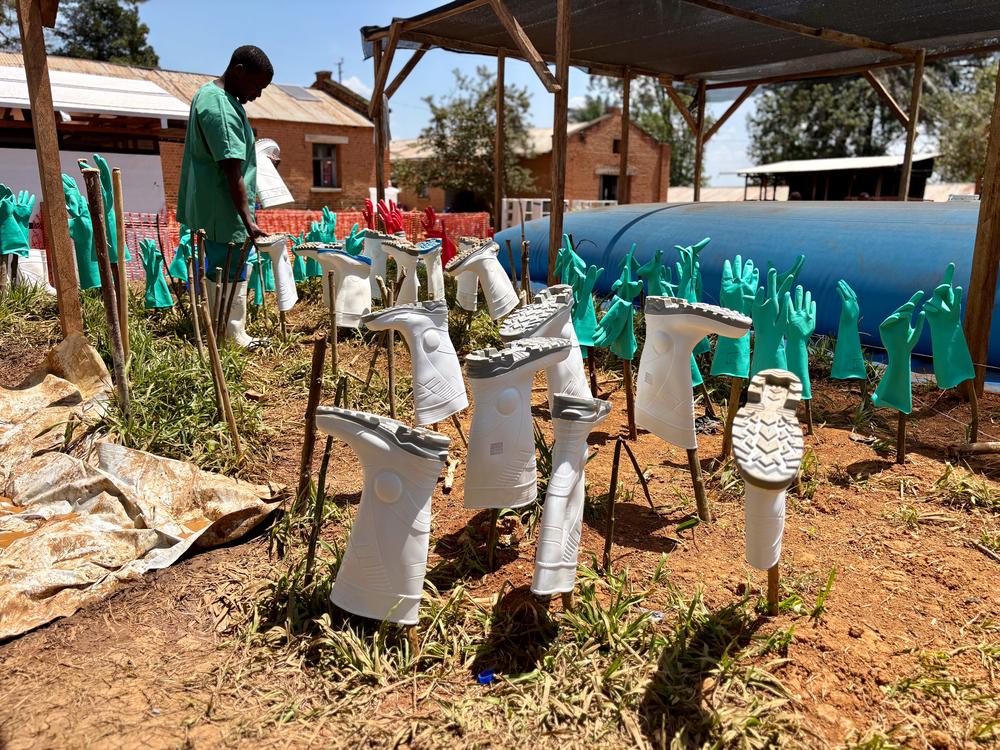 Gloves and boots used by medical teams at the MSF ETC in Bambu dry in the sun after being cleaned and disinfected.