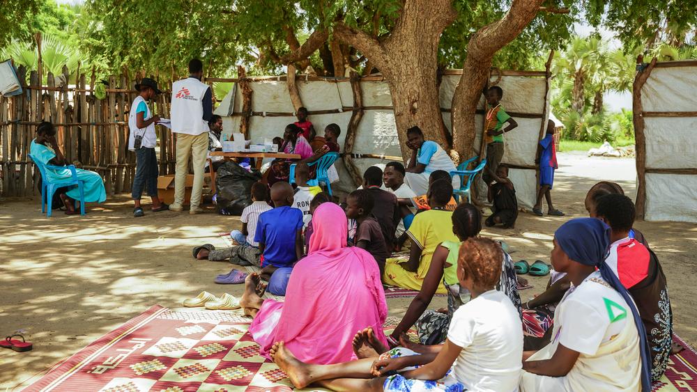 Residents of Kuerbuay village in Fangak County, Jonglei State, wait to receive medical consultations at an MSF-supported community paramedicine site. 