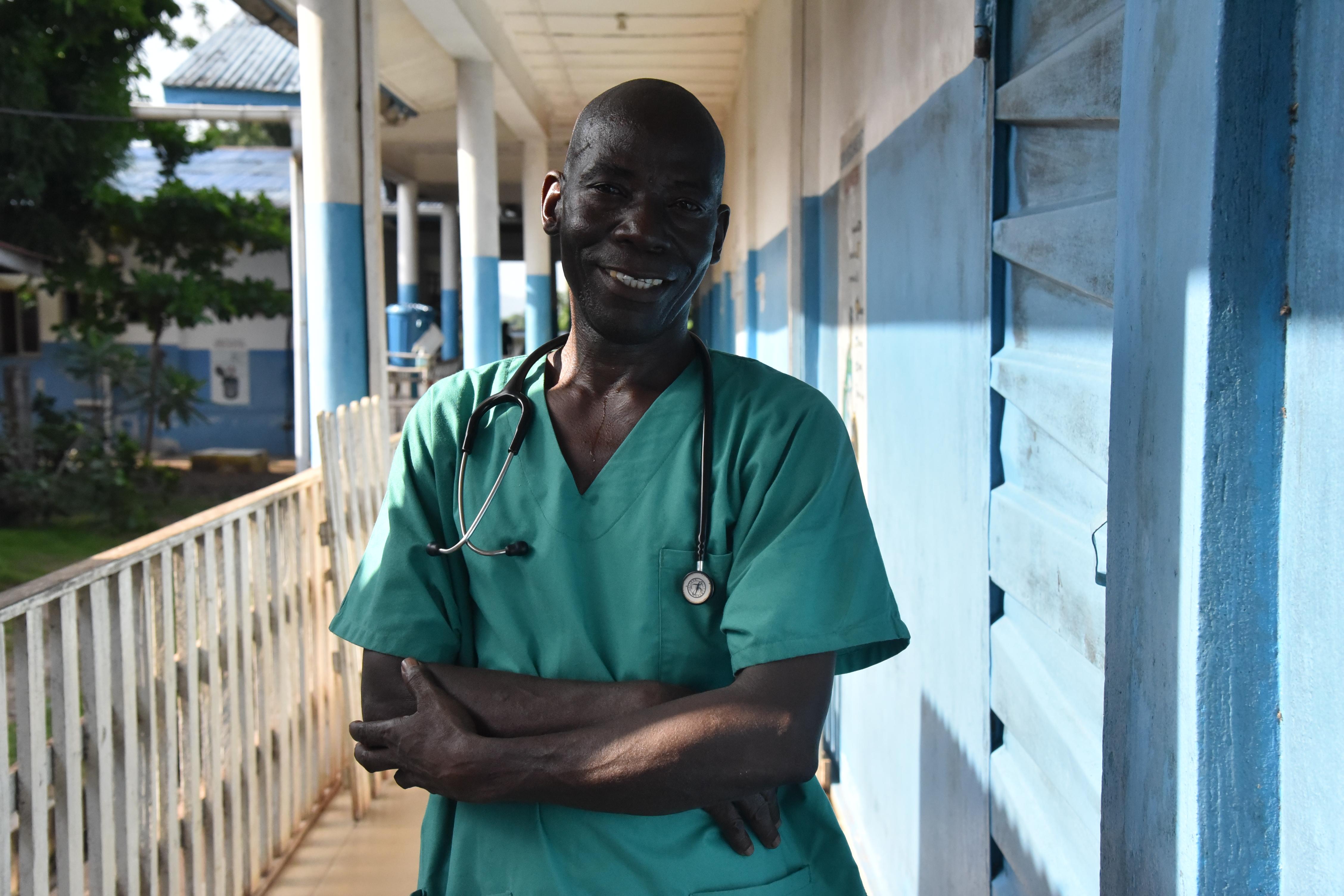Community Health Officer (CHO), Claude Ndoko standing outside the MSF supported paediatrics units of the Magburaka government hospital in Tonkolili district, Sierra Leone. 