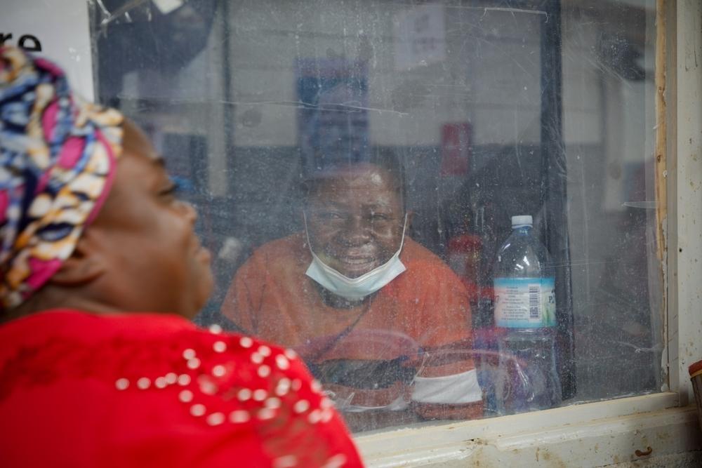 Victoire, ill with the Ebola virus, spending his days in the ETC of Kitatumba, in Butembo, waiting to leave as his health is getting better. He thinks he got ebola while working as a nurse in another hospital, as he took care of a patient who was afterwards declared positive to the Ebola virus. His wife, Kasoki, comes everyday to support and watch him, from 6.30 a.m till 6.30 p.M. 