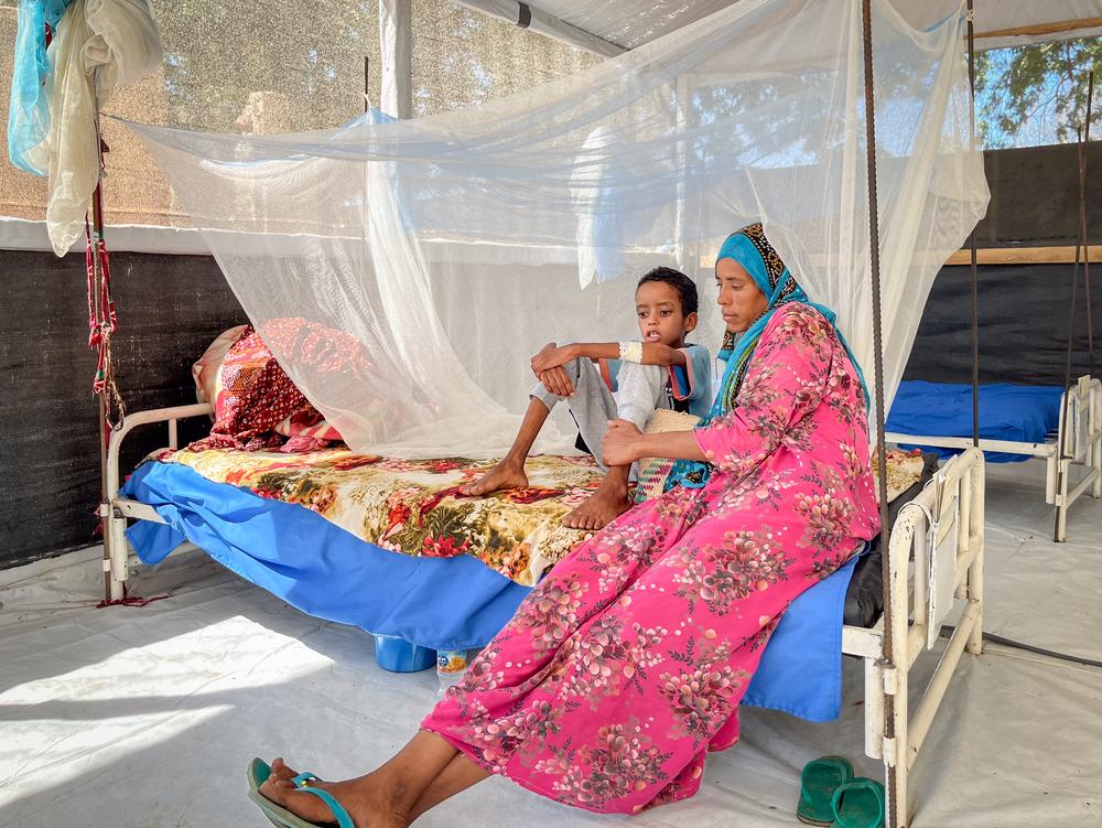 An 11-year-old boy recovering from diphtheria at Ati Hospital in Chad, supported by his mother.