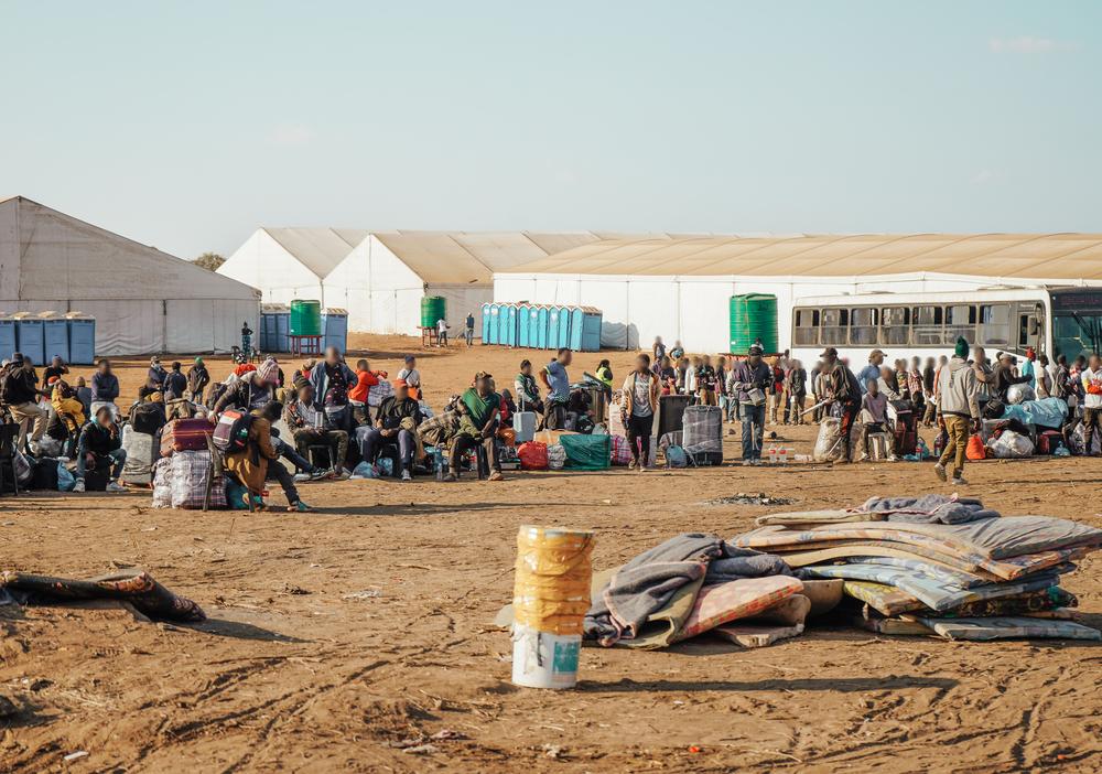 In Musina, thousands of people queue daily for buses back to their home countries after being displaced by anti-migrant violence and harassment in South Africa